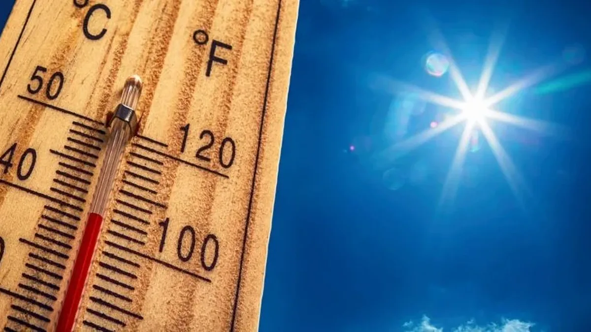 Un thermomètre affiche des températures extrêmes sous un soleil éclatant
